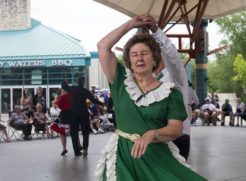 ZACHARY PRONG / WINNIPEG FREE PRESS  Shirley Gendron performs a round dance at The Forks on August 21, 2016. Members from several square dancing clubs in Winnipeg performed for passers by.