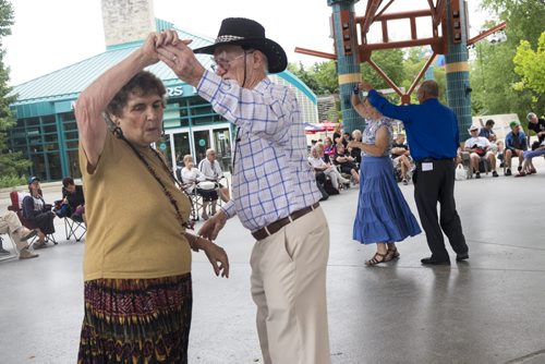 ZACHARY PRONG / WINNIPEG FREE PRESS  Sybil Gardiner and her husband Dave perform a round dance at The Forks on August 21, 2016. Members from several square dancing clubs in Winnipeg performed for passers by.