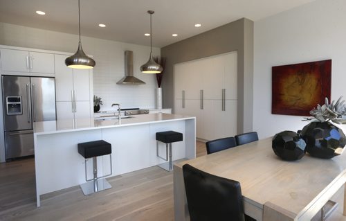 WAYNE GLOWACKI / WINNIPEG FREE PRESS   Homes.   The dining area and kitchen in the house at 34 Big Sky Drive in Oak Bluff West. The contact is Artista Homes sales rep Jennifer Gulay. Todd Lewys  story  August 22 2016