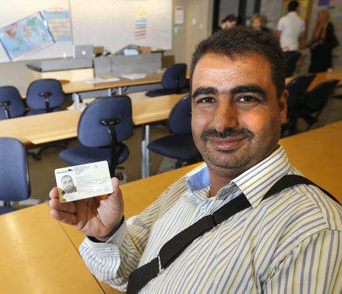 WAYNE GLOWACKI / WINNIPEG FREE PRESS  A proud Zyad Al Owimr shows his Manitoba Driver's License. He is enrolled at the  Living English program, a summertime English language classes for parents and kids at the downtown RRC campus.Carol Sanders story  August 22 2016