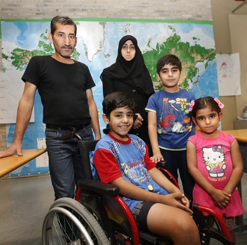 WAYNE GLOWACKI / WINNIPEG FREE PRESS   Arriving in Winnipeg last winter as Syrian refugees,  parents Zekariye (father) and Fatma (mother)  El Ahmar with their children from left, Ahmed, Muhammed and Shahad at the Living English program, a summertime English language classes for parents and kids at the downtown RRC campus.Carol Sanders story  August 22 2016