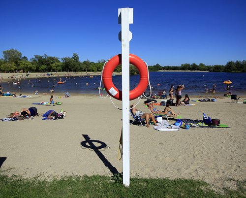 PHIL HOSSACK / WINNIPEG FREE PRESS -   A lone life ring stands guard in lieu of lifeguards while Beachgoers enjoy the water at St Malo Provincial Park Monday afternoon. See story. August 22, 2016