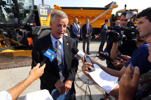BORIS MINKEVICH / WINNIPEG FREE PRESS GOVERNMENTS OF CANADA AND MANITOBA SUPPORT NATIONAL HIGHWAY SYSTEM IN MANITOBA - PRESS CONFERENCE. (centre) Blaine Pedersen, Minister of Manitoba Infrastructure talks to media at the press conference. Photo taken at 749 Cloutier Drive. NICK MARTIN STORY. August 23, 2016