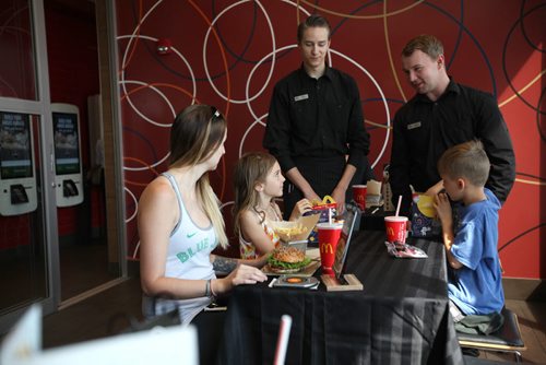 RUTH BONNEVILLE / WINNIPEG FREE PRESS  Candice Schulz and her kids Tristan - 8yrs (girl) and Tegan - 9yrs (boy) enjoy table service at the McDonalds on Regent at one of the newly designed restaurants nationwide now offering  customizable, gourmet burgers hand-delivered to your table Tuesday.   Guest Experience Leaders  will be on hand to  guide people through the new experience at each store.    See Martin Cash story.     Aug 23 / 2016