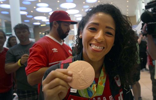 JOE BRYKSA / WINNIPEG FREE PRESS Team Canadaís Desiree Scott/ soccer shows off her bronze medal as she arrives home at Richardson International Airport tuesday morning from the Olympics in Rio - Aug 23, 2016 -(  See Scottís story)