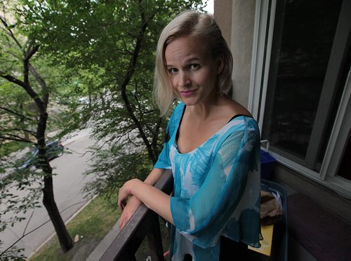 PHIL HOSSACK / WINNIPEG FREE PRESS -   Yvette Jones, poses on her downtown balcony. She was mugged and robbed yesterday walking home from work. Construction workers chased the suspect down and recovered her purse intact. See Alex De Pape story.  August 23, 2016