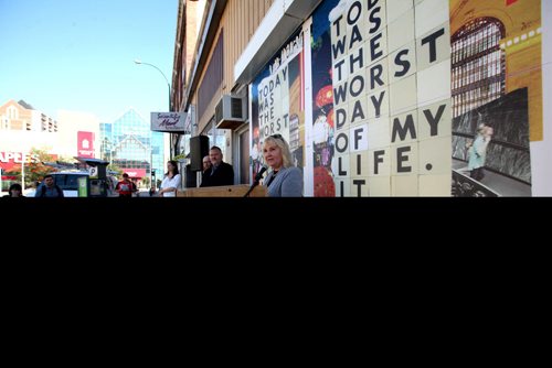 RUTH BONNEVILLE / WINNIPEG FREE PRESS Ari Driver, Placemaking Committee Chair for Dowtown Biz stands next to wallpaper creation on Kennedy street announcing new Downtown Biz initiative called Urban Wallpaper to bring beauty to vacant windows and construction sites at press conference Wednesday. Aug 24 / 2016