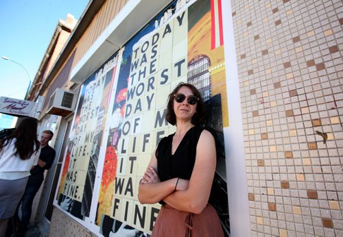 RUTH BONNEVILLE / WINNIPEG FREE PRESS  Local artist Rayna Masterton stands next to one of her wallpaper creations on Kennedy street Wednesday after press conference announcing new initiative called Urban Wallpaper in downtown Winnipeg Biz to bring beauty to vacant windows and construction sites.   Aug 24 / 2016