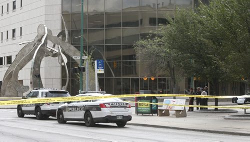 WAYNE GLOWACKI / WINNIPEG FREE PRESS     Winnipeg Police closed down the intersection of Kennedy St. and York Ave. in front of the Law Courts building Wednesday after a small device exploded by the sculpture. No one was injured. Kristin Annable story August 24 2016