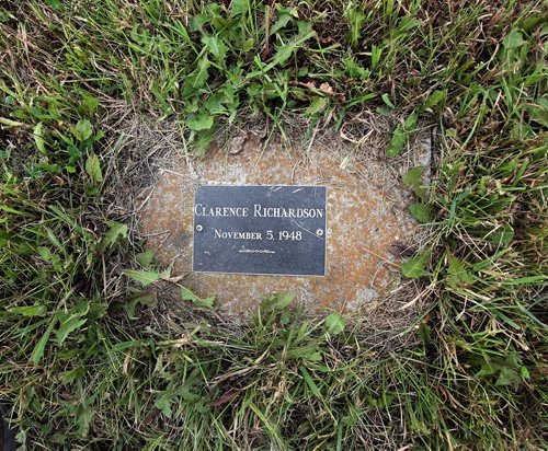 PHIL HOSSACK / WINNIPEG FREE PRESS -  A grave marker on a block of limestone rests in prairie grasses at the Headingley Goal graveyard, literally in the shadow of a cruxifix marking the smal site in the middle of a wheat field. See Bill Redekop's story.  August 24, 2016