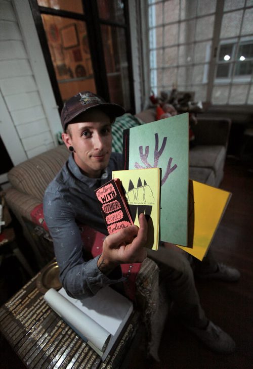 PHIL HOSSACK / WINNIPEG FREE PRESS -  Dany Reede, a Winnipeg zine maker holds some of the "Zines" he produces showcasing his work. See story. August 24, 2016