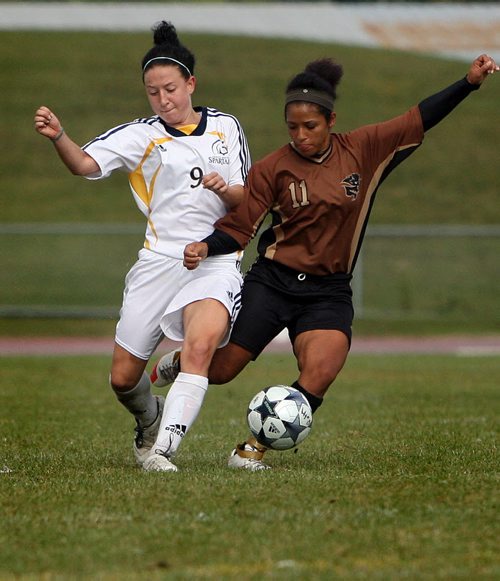 RUTH.BONNEVILLE@FREEPRESS.MB.CA Ruth Bonneville, Winnipeg Free Press Oct 4, 2009 Sports - Bison Women's Soccer Team Player #11 Desiree Scott fights for control of the ball against Trinity Western Soccer Team player #9 Natalie Boyd during their game at U of M Stadium Sunday.