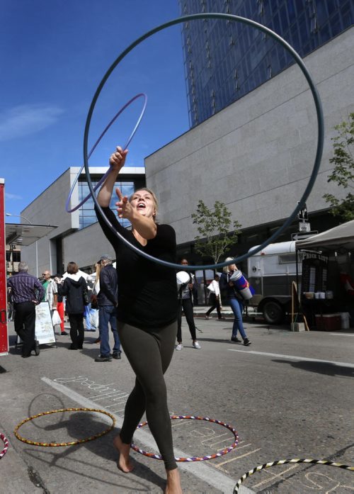 WAYNE GLOWACKI / WINNIPEG FREE PRESS    Karrie Blackburn, with Kurrent Motion gives a demonstration of her handmade and decorated hoops she had for sale Thursday at the Downtown Winnipeg Farmers' Market at Manitoba Hydro Plaza and down Edmonton St.  The booths also included fresh local vegetables and fruits, baking, preserves, meat, fish, cheese, crafts and  jewelry.  The market runs every Thursday until Oct. 20, from 10AM-3PM. August 25 2016