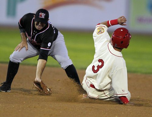 BORIS MINKEVICH / WINNIPEG FREE PRESS Fargo-Moorhead Redhawks #3 Mike Gilmartin, left, tries to tag out Winnipeg Goldeyes #3 Maikol Gonzalez, right. Gonzalez stole second base successfully in the second inning at Shaw Park in Winnipeg, Manitoba. Mike McIntyre story. August 25, 2016