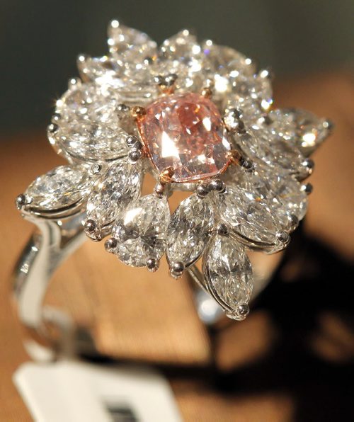 BORIS MINKEVICH / WINNIPEG FREE PRESS COLOURED DIAMONDS FEATURE - This red/pink coloured diamond set with other stones in a ring.  Photo taken at Gurevich Gallery (200-62 Albert Street in Winnipeg). For Jen Zoratti story. August 25, 2016