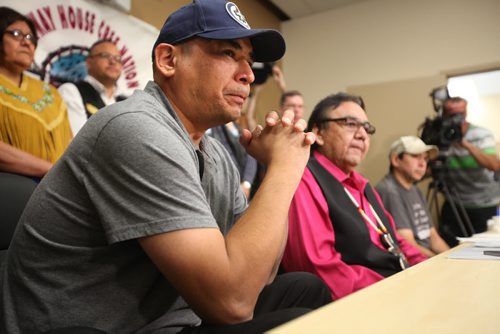 RUTH BONNEVILLE / WINNIPEG FREE PRESS  Norway House comfort resident Leon Swanson (left) tears up while former Aboriginal Affairs Minister Eric Robinson announces to the media that Swanson and Norway House resident David Tait (far right) are victims of the second case of switched children at birth (Swanson and Tait) at Norway House Offices in Winnipeg Friday.    Aug 26, 2016