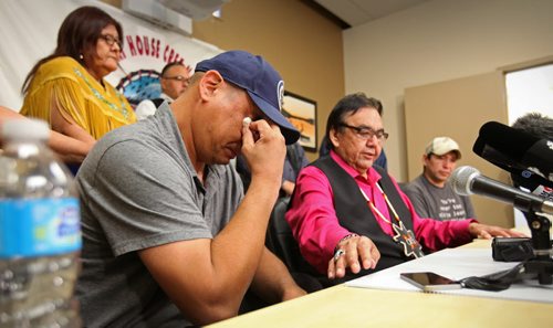 RUTH BONNEVILLE / WINNIPEG FREE PRESS  Norway House comfort resident Leon Swanson (left) tears up while former Aboriginal Affairs Minister Eric Robinson announces to the media that Swanson and Norway House resident David Tait (far right) are victims of the second case of switched children at birth (Swanson and Tait) at Norway House Offices in Winnipeg Friday.    Aug 26, 2016