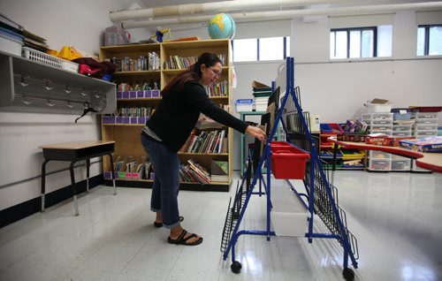 RUTH BONNEVILLE / WINNIPEG FREE PRESS  Local - Isacc Brock photo page for 49.8 Feature / Borders Page for back to school.  Special Education Resource Teacher Erica Barto fills out a book rack with books as she prepare for another year of students in her class just days before  the 2016/2017 school year begins.     August 25, 2016