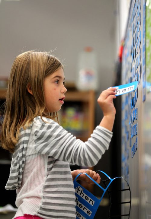 RUTH BONNEVILLE / WINNIPEG FREE PRESS  Local - Isacc Brock photo page for 49.8 Feature / Borders Page for back to school.  Six-year-old Abigail Barto hangs out with her mom, Special Education Resource Teacher Erica Barto helping her place high frequency words on a white board as her mom prepares for another year of students in her class before  the 2016/2017 school year begins.    August 25, 2016