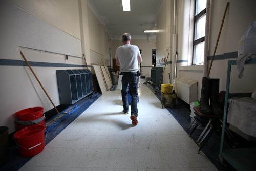 RUTH BONNEVILLE / WINNIPEG FREE PRESS  Local - Isacc Brock photo page for 49.8 Feature / Borders Page for back to school.  School custodian Tom Brown wheels a mop pail to wash the floors in one of the classrooms as he preps the school for new students in fall.    August 25, 2016