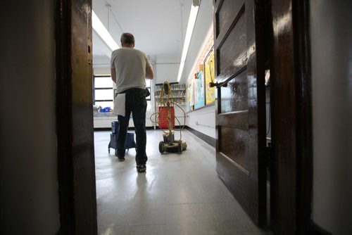 RUTH BONNEVILLE / WINNIPEG FREE PRESS  Local - Isacc Brock photo page for 49.8 Feature / Borders Page for back to school.  School custodian Tom Brown wheels a mop pail to wash the floors in one of the classrooms as he preps the school for new students in fall.     August 25, 2016