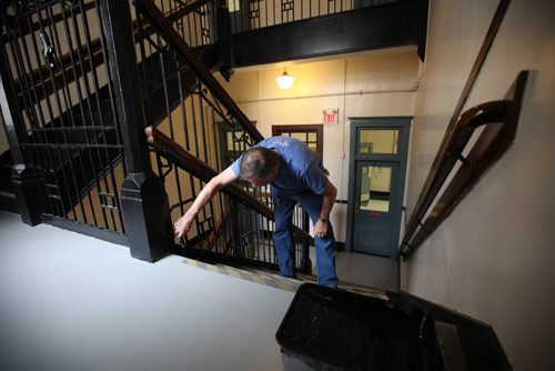 RUTH BONNEVILLE / WINNIPEG FREE PRESS  Local - Isacc Brock photo page for 49.8 Feature / Borders Page for back to school.  Custodian Ian Barry gives the stairs a fresh coat of paint prepping the schooll for students.     August 25, 2016