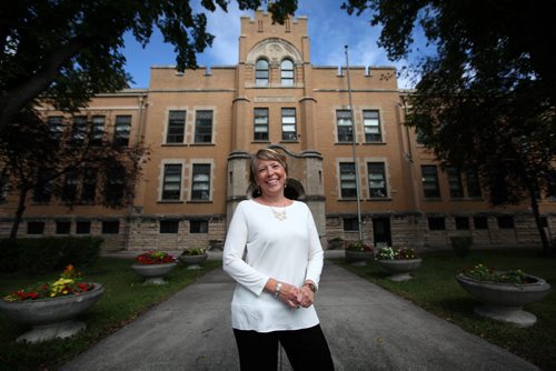 RUTH BONNEVILLE / WINNIPEG FREE PRESS  Local - Isacc Brock photo page for 49.8 Feature / Borders Page for back to school.  School principle Melody Woloschuk is all smiles outside the school looking forward to welcoming 2016/2017 students to school.  The school has 2 new classes, a Ojibway and Cree Kindergarden classes starting in Sept.    August 25, 2016