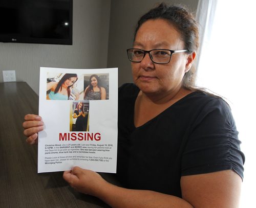 BORIS MINKEVICH / WINNIPEG FREE PRESS Melinda Wood poses for a photo at the Comfort Inn Airport @ 1770 Sargent Ave .  She holds the poster made up for her 21-yr-old daughter Christine Wood, who has been missing since Aug. 19th. Alexandra De Pape story. August 26, 2016
