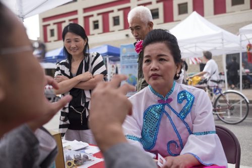 ZACHARY PRONG / WINNIPEG FREE PRESS  Su Mei receives a diagnosis from Zhang Qiu Shi, a traditional Chinese medicine practitioner, at the 8th Annual Chinatown Street Festival on August 27, 2016. Hundreds of Winnipegers were there to enjoy live music, dancing, food and activities for children.