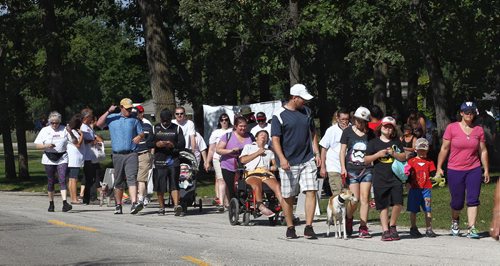 MIKE DEAL / WINNIPEG FREE PRESS  Participants walk along Locomotive Drive in Assiniboine Park for the 12th annual Brain Injury Walk Sunday morning.   160828 Sunday, August 28, 2016