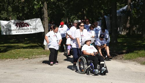 MIKE DEAL / WINNIPEG FREE PRESS  Participants walk along Locomotive Drive in Assiniboine Park for the 12th annual Brain Injury Walk Sunday morning.   160828 Sunday, August 28, 2016