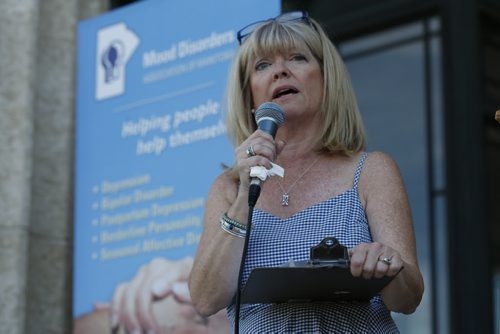 JOHN WOODS / WINNIPEG FREE PRESS Bonnie Bricker, whose son had mental illness, speaks at a mental illness rally at the Manitoba Legislature Sunday, August 28, 2016.