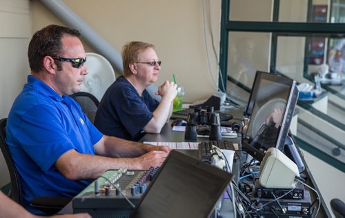 MIKE DEAL / WINNIPEG FREE PRESS Regan Katz assistant GM and scoreboard operator (left) and Steve Eitzen the official scorekeeper during the Winnipeg Goldeyes game against the Sioux City Exploerers on Sunday afternoon. 20160828 - Sunday August 28, 2016 For a Mike McIntyre feature