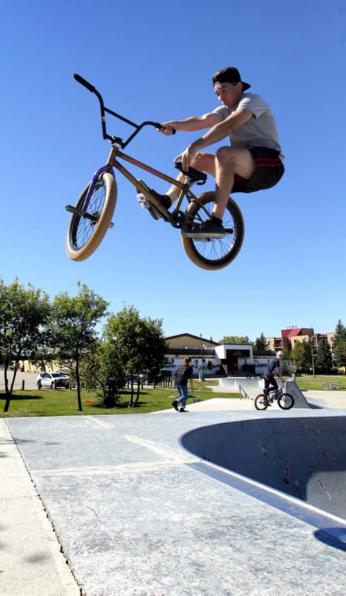 BORIS MINKEVICH / WINNIPEG FREE PRESS STANDUP - Dustin Mailhot catches some major air while pulling off a BMX bike trick called a T-Bog this afternoon at St. Vital Skatepark (within Riel Park). The park is located at 580 St. Anne's Rd (Meadowood Drive and St. Anne's Road) and consists of an 11,000 sq. ft. plaza. It was built in 2003. August 29, 2016