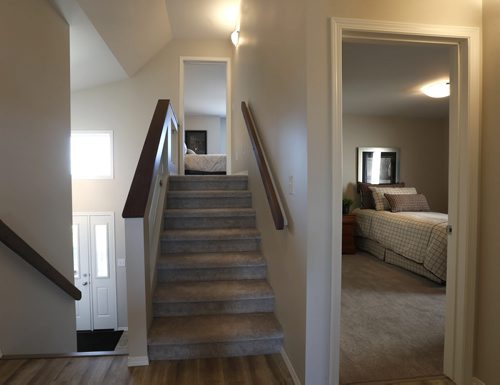 WAYNE GLOWACKI / WINNIPEG FREE PRESS   Homes. The stairs to the master bedroom, a bedroom at right and the main door at left in 15 Larry Vickar Drive in Devonshire Village (Transcona). The Hilton Homes Spencer Curtis, Todd Lewys story August 29 2016