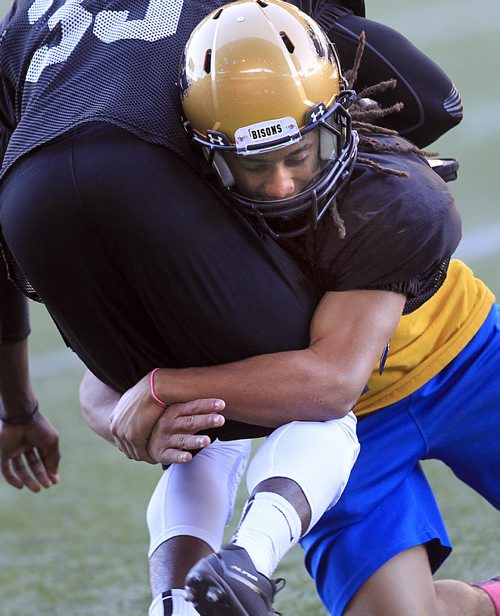 PHIL HOSSACK / WINNIPEG FREE PRESS - Marcel Arruda-Welch makes a tackle in a drill at a Bisons workout Monday. See Scott Billeck's story. August 29, 2016