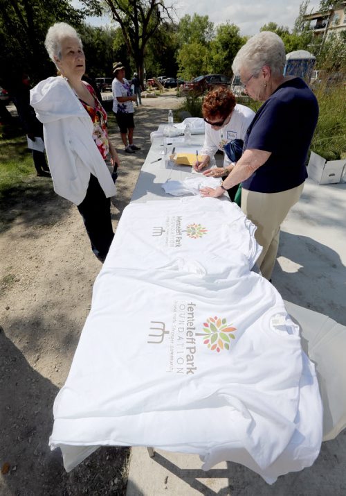 JASON HALSTEAD / WINNIPEG FREE PRESS  Volunteers sell t-shirts as the Henteleff Park Foundation held the grand opening of its interpretive centre at Henteleff Park at 1964 St. Mary's Rd. on Aug 27, 2016.   (See Social Page)