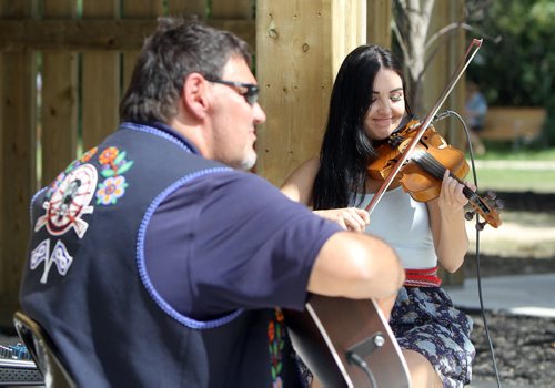 JASON HALSTEAD / WINNIPEG FREE PRESS  Musicians Al Desjarlais and Melissa St. Goddard perform as the Henteleff Park Foundation held the grand opening of its interpretive centre at Henteleff Park at 1964 St. Mary's Rd. on Aug 27, 2016.   (See Social Page)