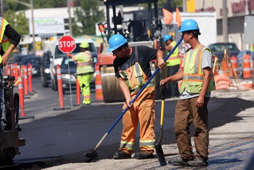 JOE BRYKSA / WINNIPEG FREE PRESS Construction crews lay new asphalt on St Marys road in Winnipeg Tuesday- Aug 30, 2016 -(See Santin Story)