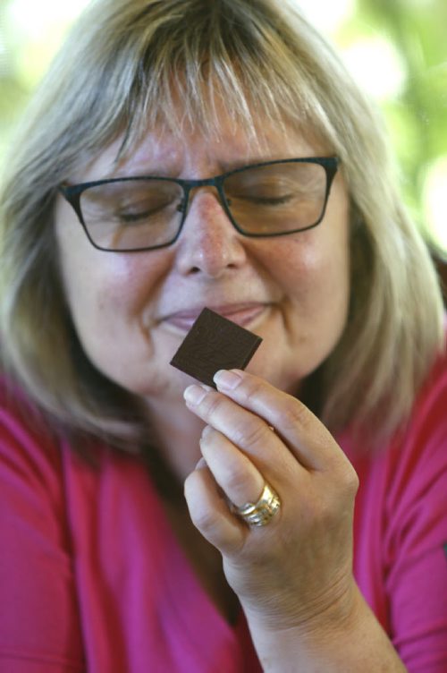 WAYNE GLOWACKI / WINNIPEG FREE PRESS  Food feature piece on chocolate tasting. Doreen Pendgracs smells the chocolate, she says chocolate should excite all of your senses, smell,taste and sound..  Alison Gillmor story August 30 2016