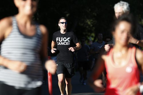 JOHN WOODS / WINNIPEG FREE PRESS Jared Spier, partner of Joanne Schiewe, joins other runners on a memorial 5km run for Schiewe, who died yesterday of brain cancer, in Winnipeg's Assiniboine Park Tuesday, August 30, 2016