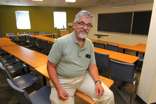 BORIS MINKEVICH / WINNIPEG FREE PRESS ENT - Neil Funk-Unrah, PhD, the associate dean of Menno Simons College/associate professor of conflict resolution, poses for a photo in one of the classrooms at Menno Simons College (102-520 Portage Ave). For feature about negotiation by Allan Small. August 31, 2016