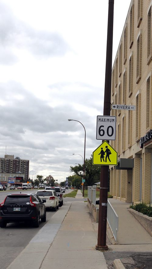 BORIS MINKEVICH / WINNIPEG FREE PRESS School zone speed confusion near the 1600 block of Pembina Highway. There is a sign that posted 60 with a school sign under it. The photo radar guy confirmed he is enforcing 60km/hr and not 50km/hr or 30km/hr. There is some confusion with the two signs being posted together and what the rules are. August 31, 2016