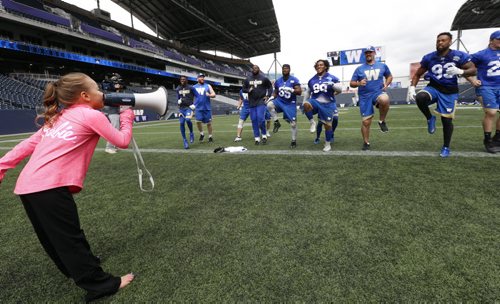 WAYNE GLOWACKI / WINNIPEG FREE PRESS  After the Winnipeg Blue Bombers practice Wednesday at Investors Group Field, some of the players had an opportunity to be put through some additional training by seven year old  Stefanie Gatin, one of Winnipegs top gymnasts in her class. She was selected to experience being a professional football coach  for a day to exemplify Mattel's Barbie dolls' theme "You Can Be Anything" campaign. The news release states "Barbie, the doll whos experienced 180 careers and counting, believes that young girls can live out any career they can imagine." August 31 2016