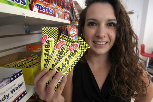 JOE BRYKSA / WINNIPEG FREE PRESS Teeyahs- 166 Hargrave St owner Tia Medeiros in her specialty candy shop holding Abba- Zaba bars-  Sept 02, 2016 -(See David Sanderson story)