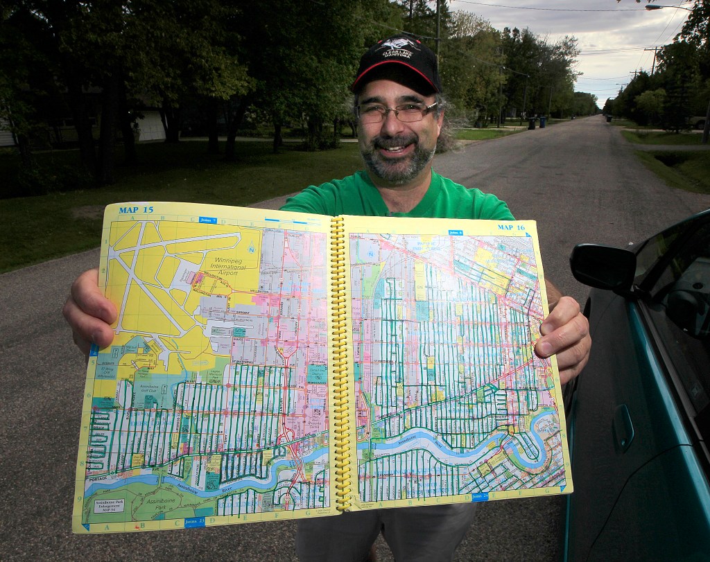PHIL HOSSACK / WINNIPEG FREE PRESS -  This is for Intersection piece on Bill Fugler, owner of (currently closed) Neighborhood Café & Bookstore ----Shots of Bill trekking through Charlswood Thursday afternoon. Bill shows off a map book in which he's marked in green the streets he's trekked.
Besides running the café, Bill has made it his mission during the last 3 years to walk every street in Winnipeg. He walks day or night, depending on his schedule (right now he has lots of time on his hands, as his café is involved in a legal battle with the city)  Dave Sanderson story. September 8, 2016