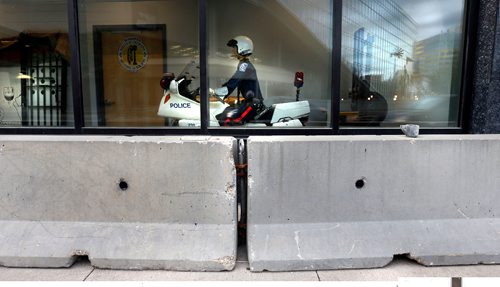 WAYNE GLOWACKI / WINNIPEG FREE PRESS
 

 The temporary concrete barrier by the new Police HQ building that also includes the Police Museum along Smith Street.. Sept. 9 2016