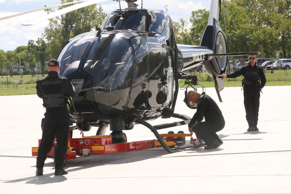 JOE BRYKSA / WINNIPEG FREE PRESSCrew prepares Winnipeg Police Service Air 1 helicopter from 17th Wing in Winnipeg Friday afternoon for flight - Sept 09, 2016 -(See Story)