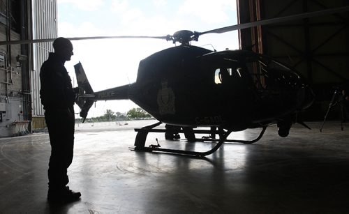 JOE BRYKSA / WINNIPEG FREE PRESSConstable Noel Matyas  Tactical Flight Officer prepares for flight  of Winnipeg Police Service Air 1 helicopter from 17th Wing in Winnipeg Friday afternoon- Sept 09, 2016 -(See Story)