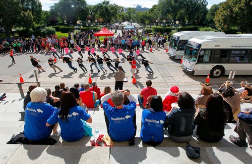 BORIS MINKEVICH / WINNIPEG FREE PRESS
STANDUP - 2016 Tri-Government Bus Pull at the Manitoba Legislative Building Grounds - South Plaza.The Challenge has been issued to all participating federal, provincial and municipal departments to enter teams in the 2016 Tri-Government 8th Annual Bus Pull to show their pride, have fun, beat last year's time and help raise awareness for the Government All Charities and United Way campaigns. This is a wide angle photo from the top of the steps. Sept. 9, 2016